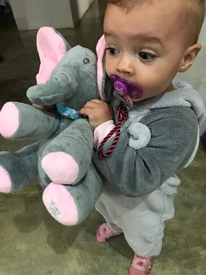 baby with peekaboo singing elephant